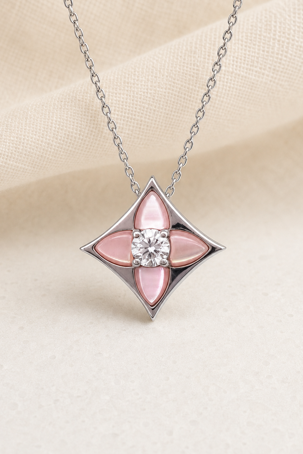 Impimo Natural Pink Mother of Pearl & Moissanite Pendant - Four-Point Star - 925 Sterling Silver with 18K White Gold Plating | close-up detail of the setting