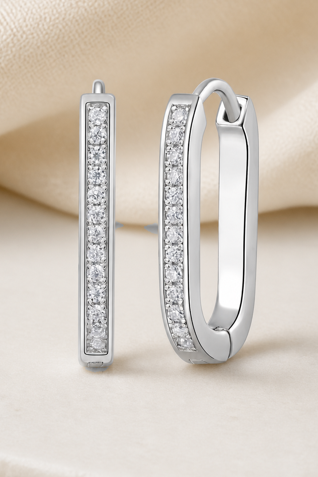 Impimo 0.15 CT (Total) Moissanite Round Cut Earrings - Elongated Pavé Huggie Hoop - 925 Sterling Silver with 18K White Gold Plating | close-up detail of the setting