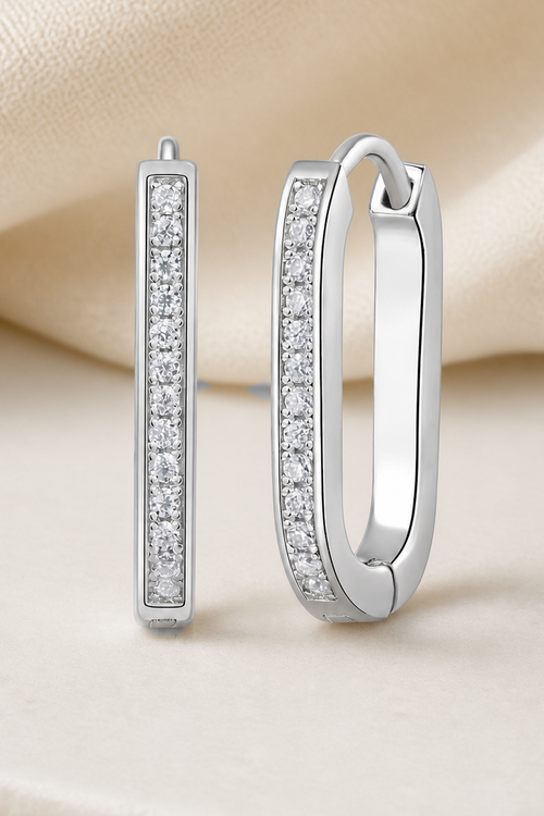 Impimo 0.15 CT (Total) Moissanite Round Cut Earrings - Elongated Pavé Huggie Hoop - 925 Sterling Silver with 18K White Gold Plating | close-up detail of the setting