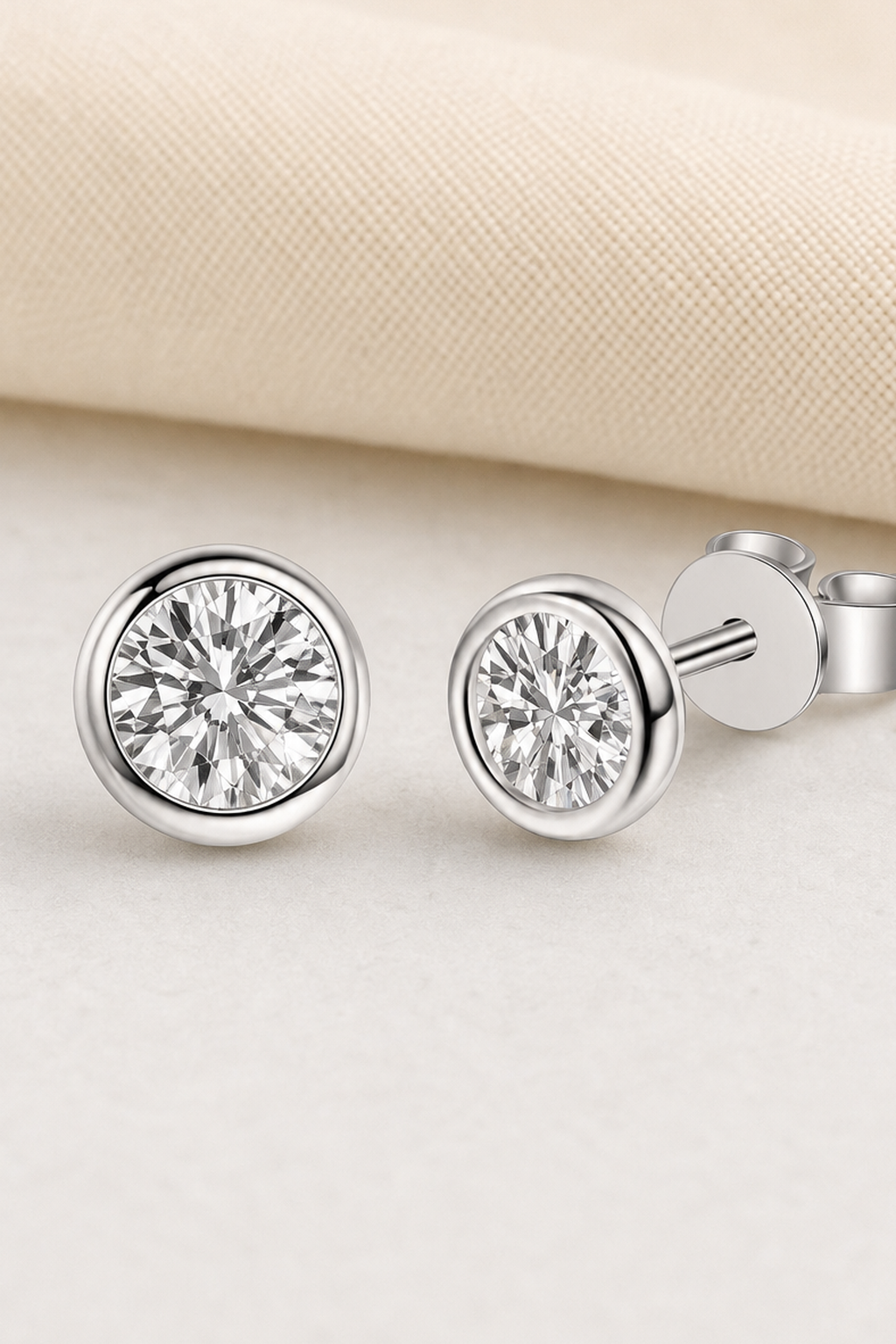 Impimo 0.6/1/2 CT Moissanite Round Cut Earrings - 925 Sterling Silver with 18K White Gold Plating | close-up detail of the setting