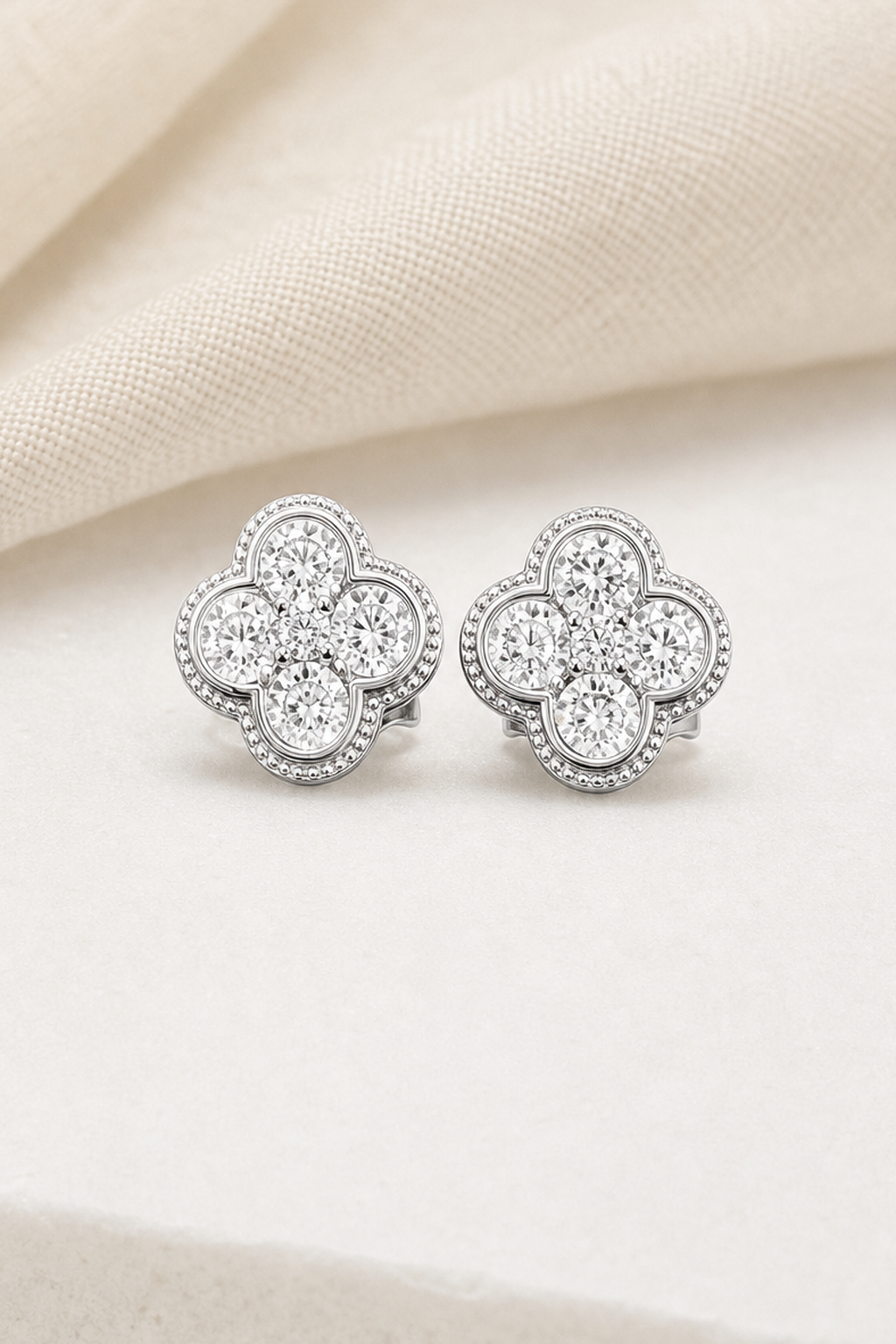 Impimo 1.9 CT (Pair) Moissanite Round Cut Earrings - 925 Sterling Silver with 18K White Gold Plating | close-up detail of the setting