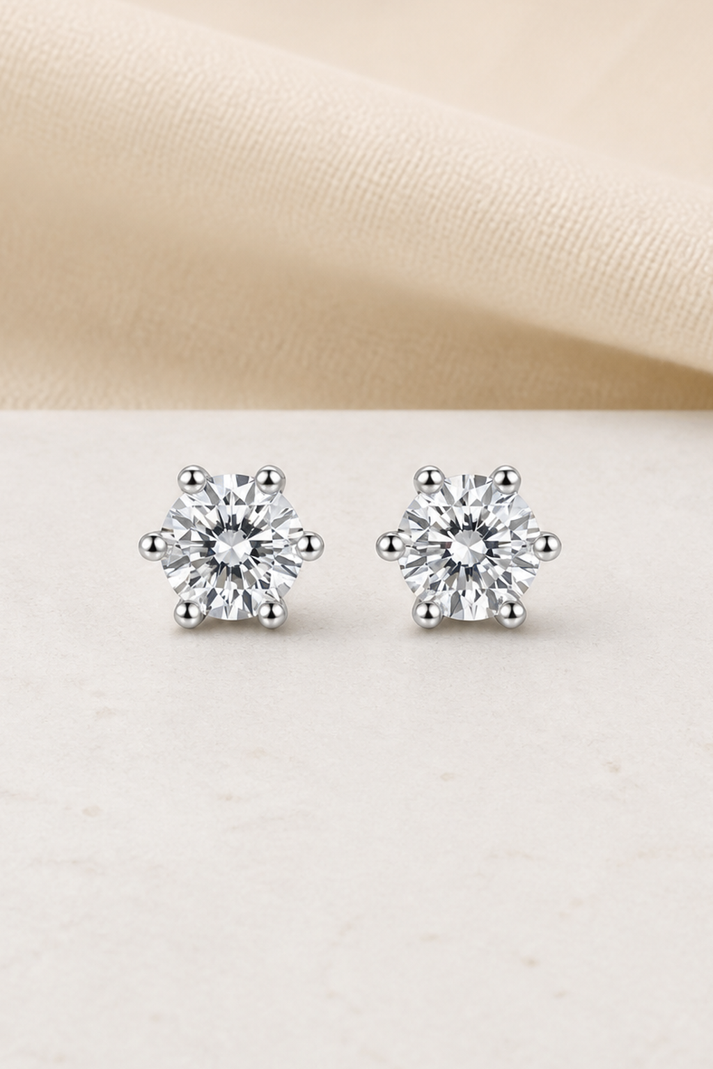 Impimo 0.6/1/2/4/6 CT (Pair) Moissanite Round Cut Earrings - 925 Sterling Silver with 18K White Gold Plating | close-up detail of the setting