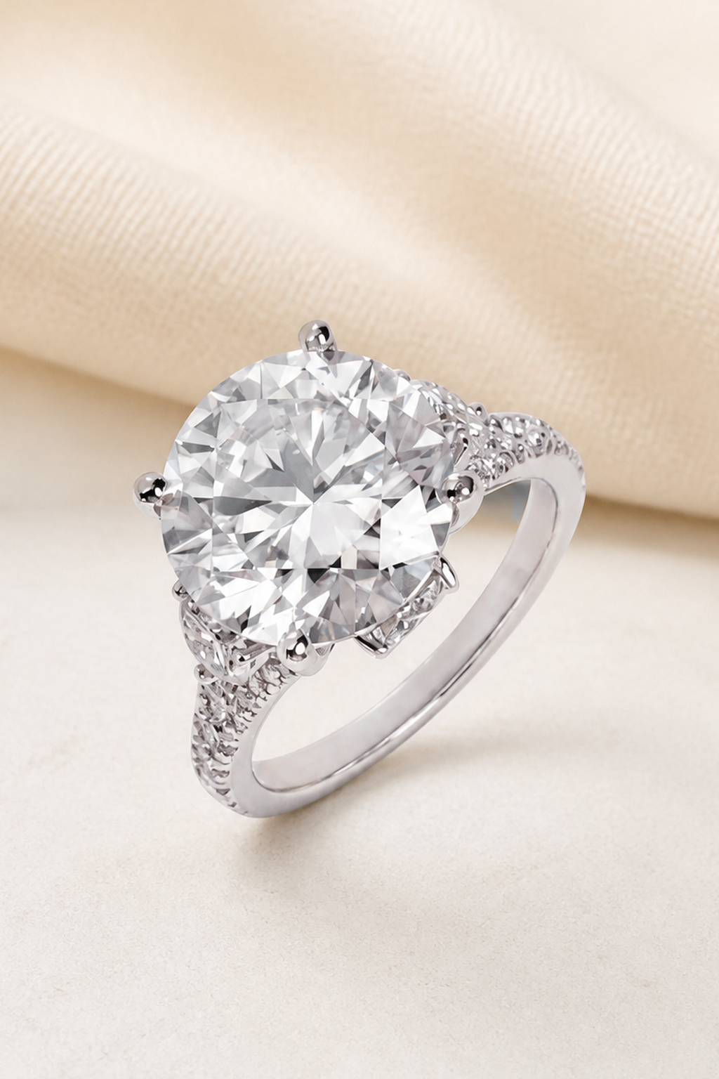 Impimo 10 CT Moissanite Round Cut Ring - Three-Stone Pavé Shank - 925 Sterling Silver with 18K White Gold Plating | close-up detail of the setting