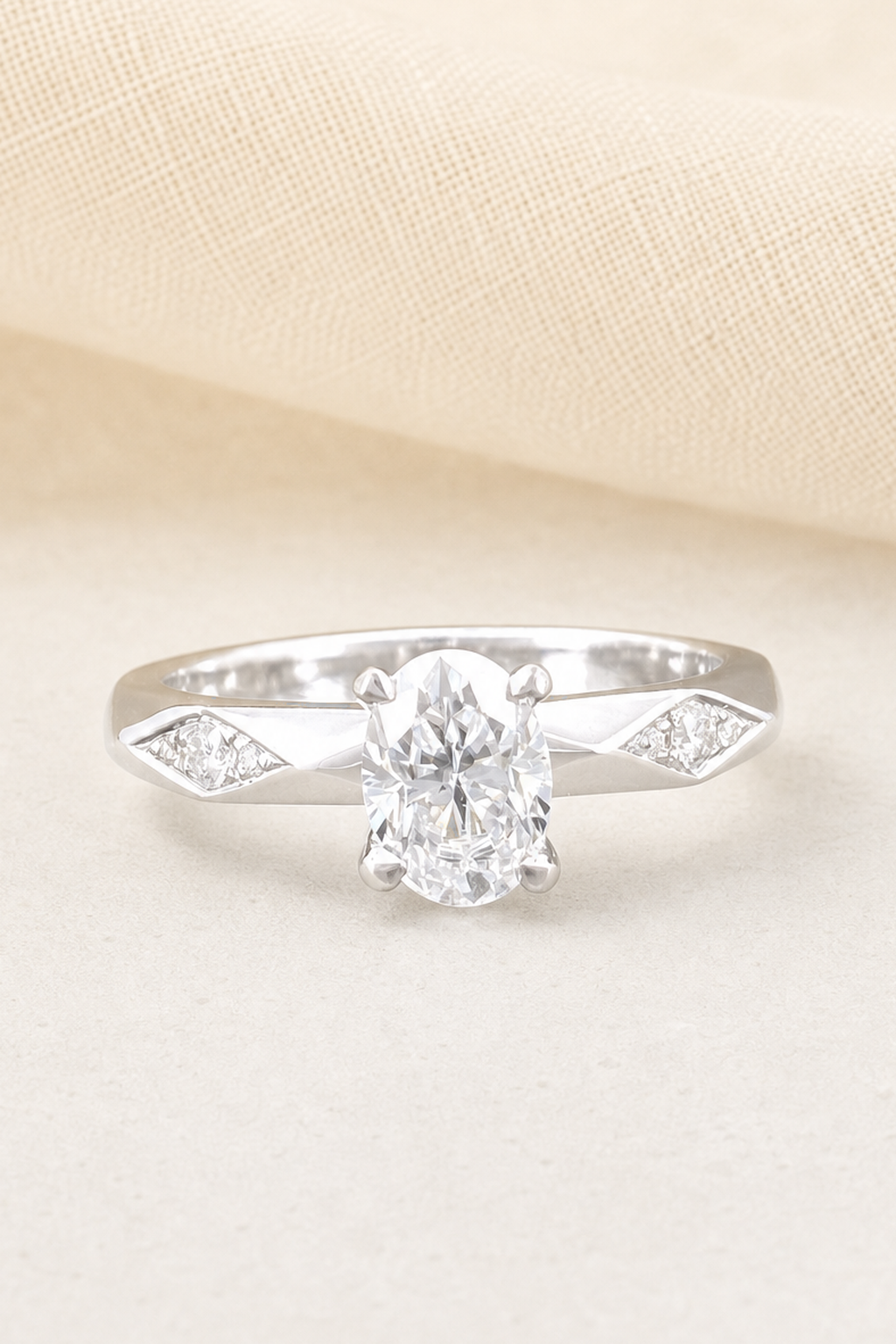 Impimo 1-2 CT Moissanite Oval Solitaire Ring with 0.20 CT Shoulder Stones - 925 Sterling Silver 18K White Gold | close-up detail of the setting