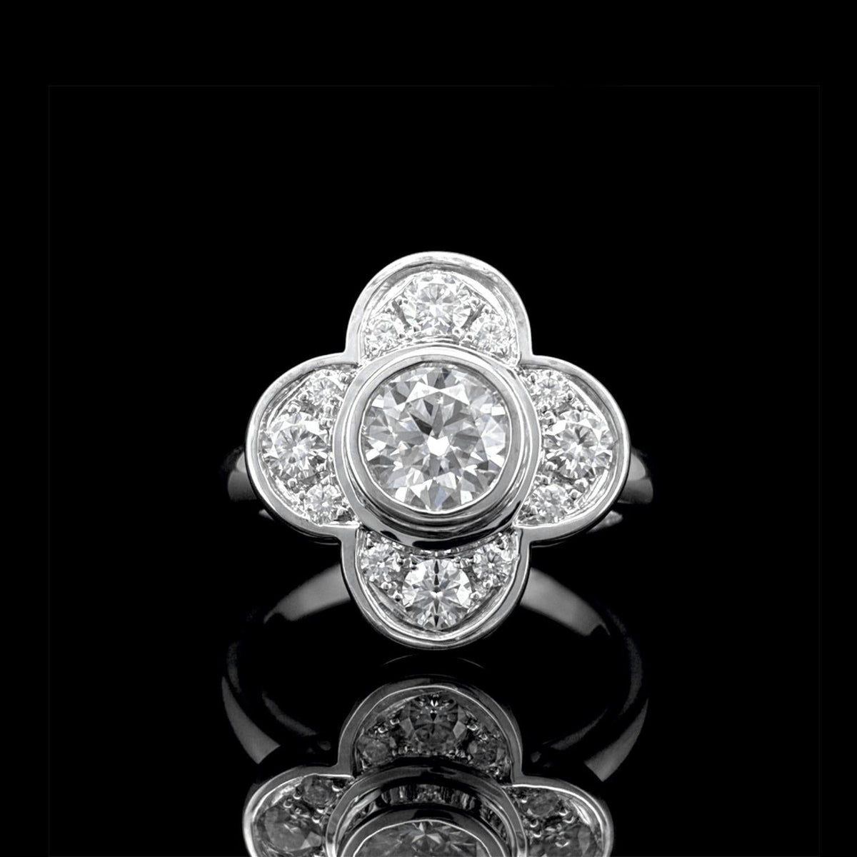 Impimo 1.0 CT moissanite floral ring, 1.6 CT total, 925 sterling silver with 18K white gold plating - the floral cluster head shown front on.