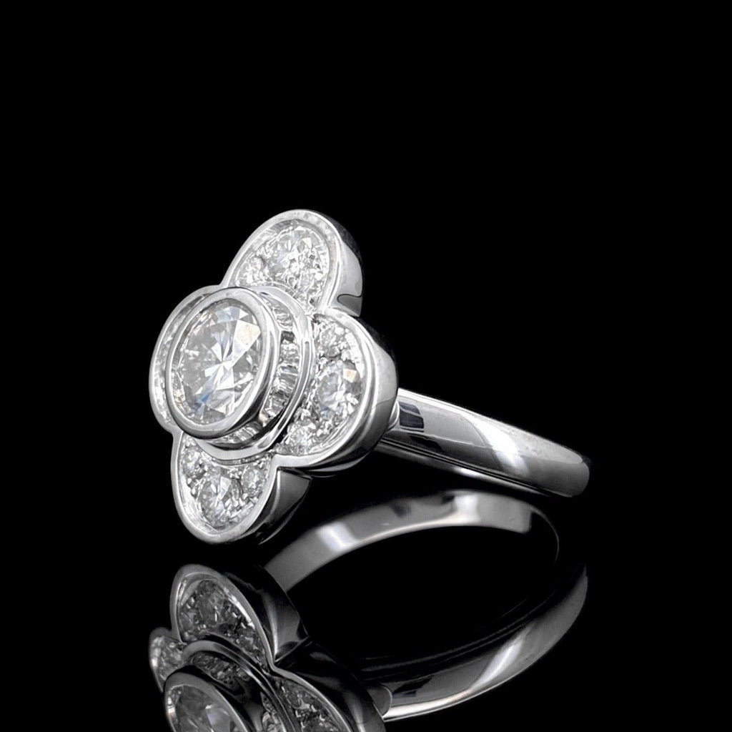 Impimo 1.0 CT moissanite floral ring - front view of the round centre stone and the prong-set petal stones around it.