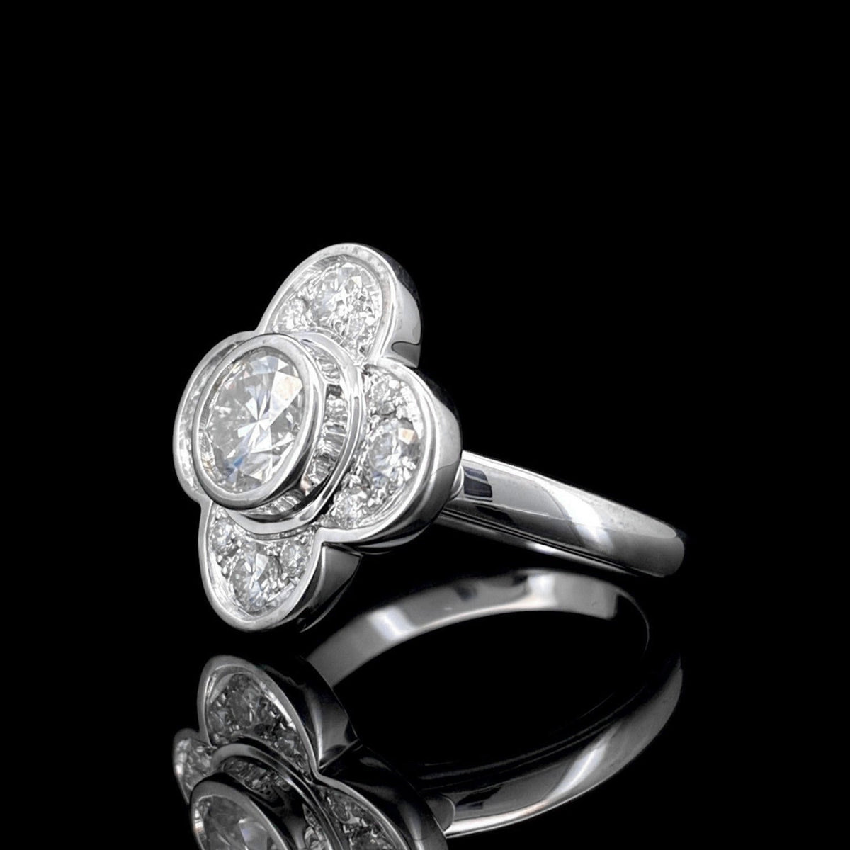 Impimo 1.0 CT moissanite floral ring - front view of the round centre stone and the prong-set petal stones around it.
