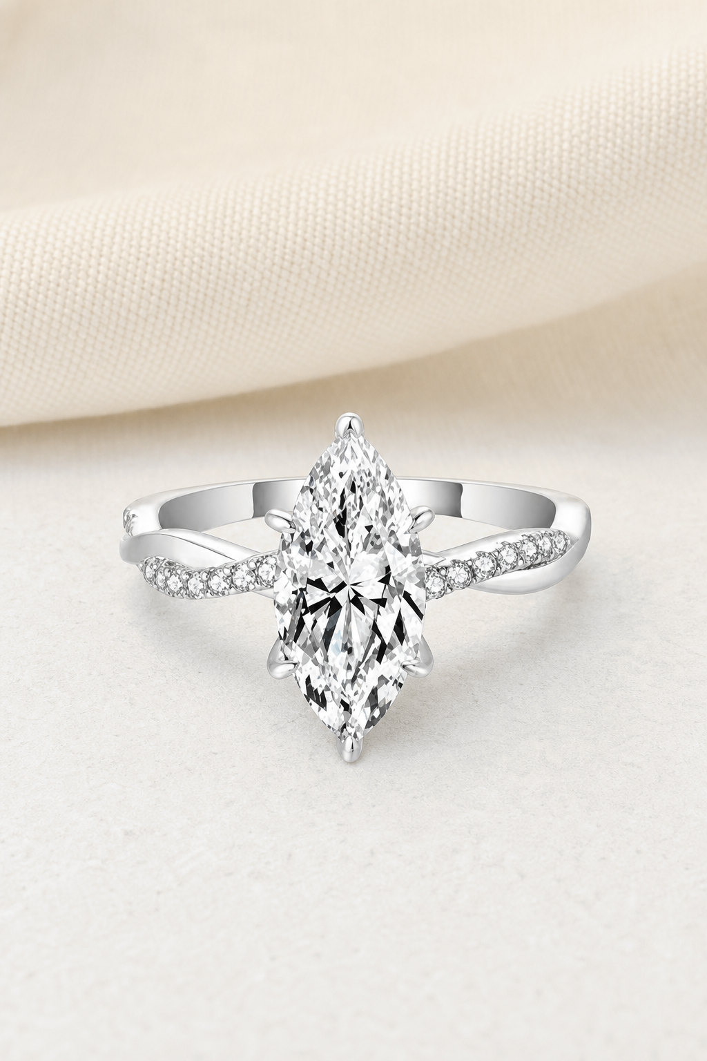 Impimo 2 CT Moissanite Multiple Shape Ring - 925 Sterling Silver with 18K White Gold Plating | display view on ivory linen - marquise cut
