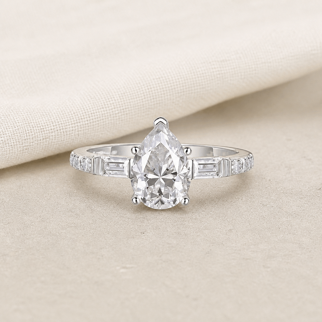 Impimo Moissanite 1.5 CT Pear Cut Ring - 925 Sterling Silver with 18K White Gold Plating | additional view on ivory linen