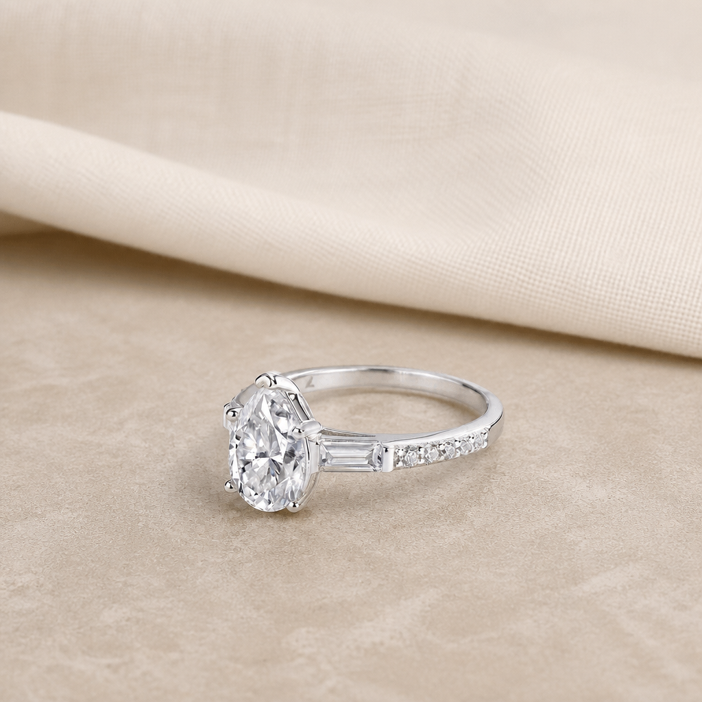 Impimo Moissanite 1.5 CT Pear Cut Ring - 925 Sterling Silver with 18K White Gold Plating | additional view on ivory linen