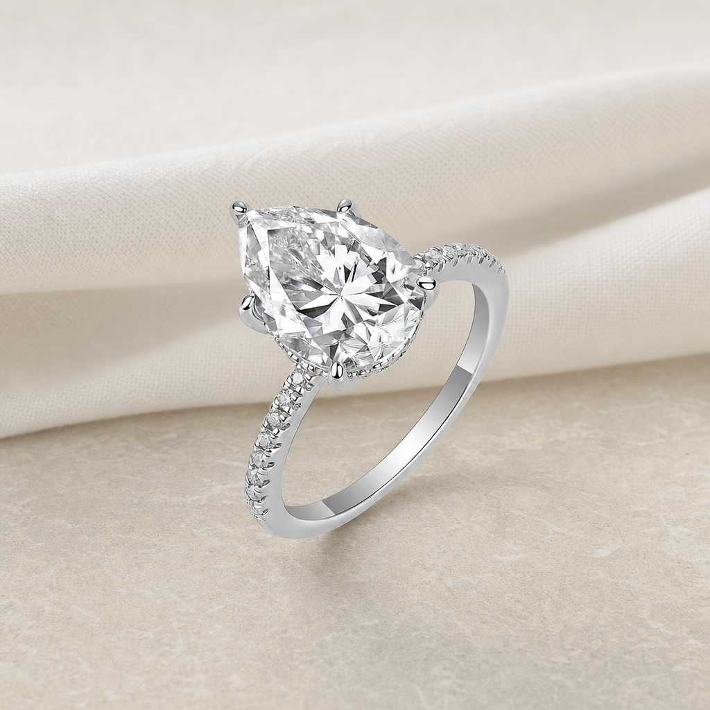 Impimo 4 CT Moissanite Pear Cut Ring - 925 Sterling Silver with 18K White Gold Plating | additional view on ivory linen