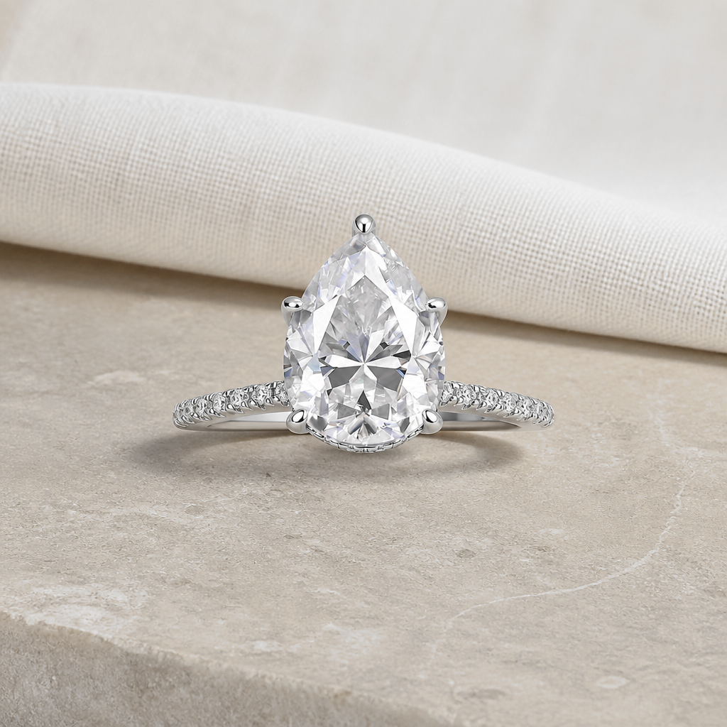 Impimo 4 CT Moissanite Pear Cut Ring - 925 Sterling Silver with 18K White Gold Plating | additional view on ivory linen